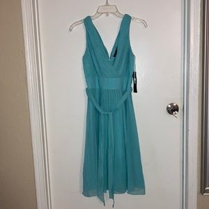 Raph Lauren dress zise 4 with closure at the back and a beautiful ribbon belt